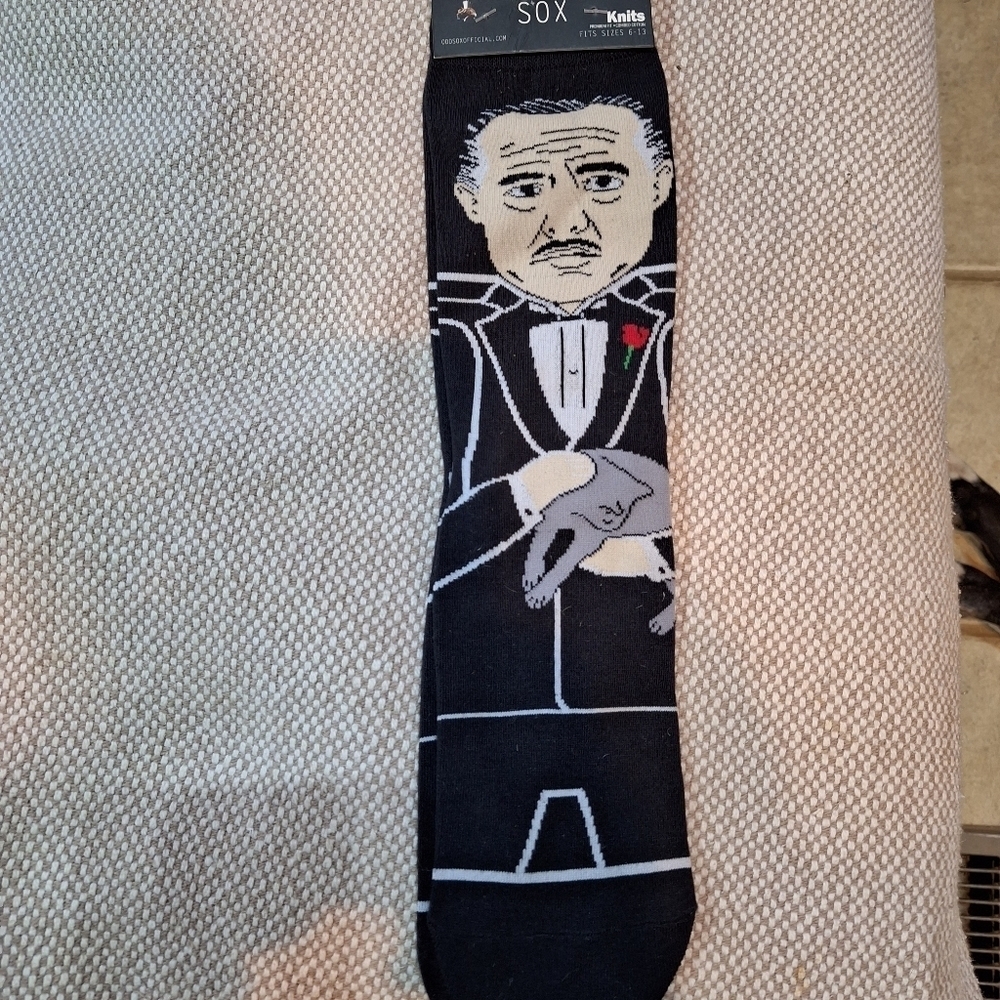 A pair of NWT Odd Sox "the Godfather" knits. NWT